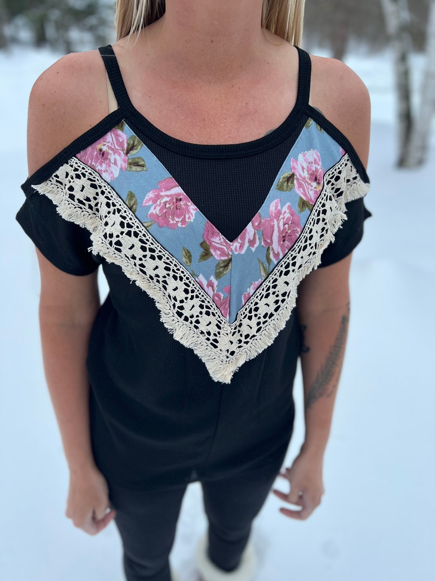 Black cold-shoulder knit floral top