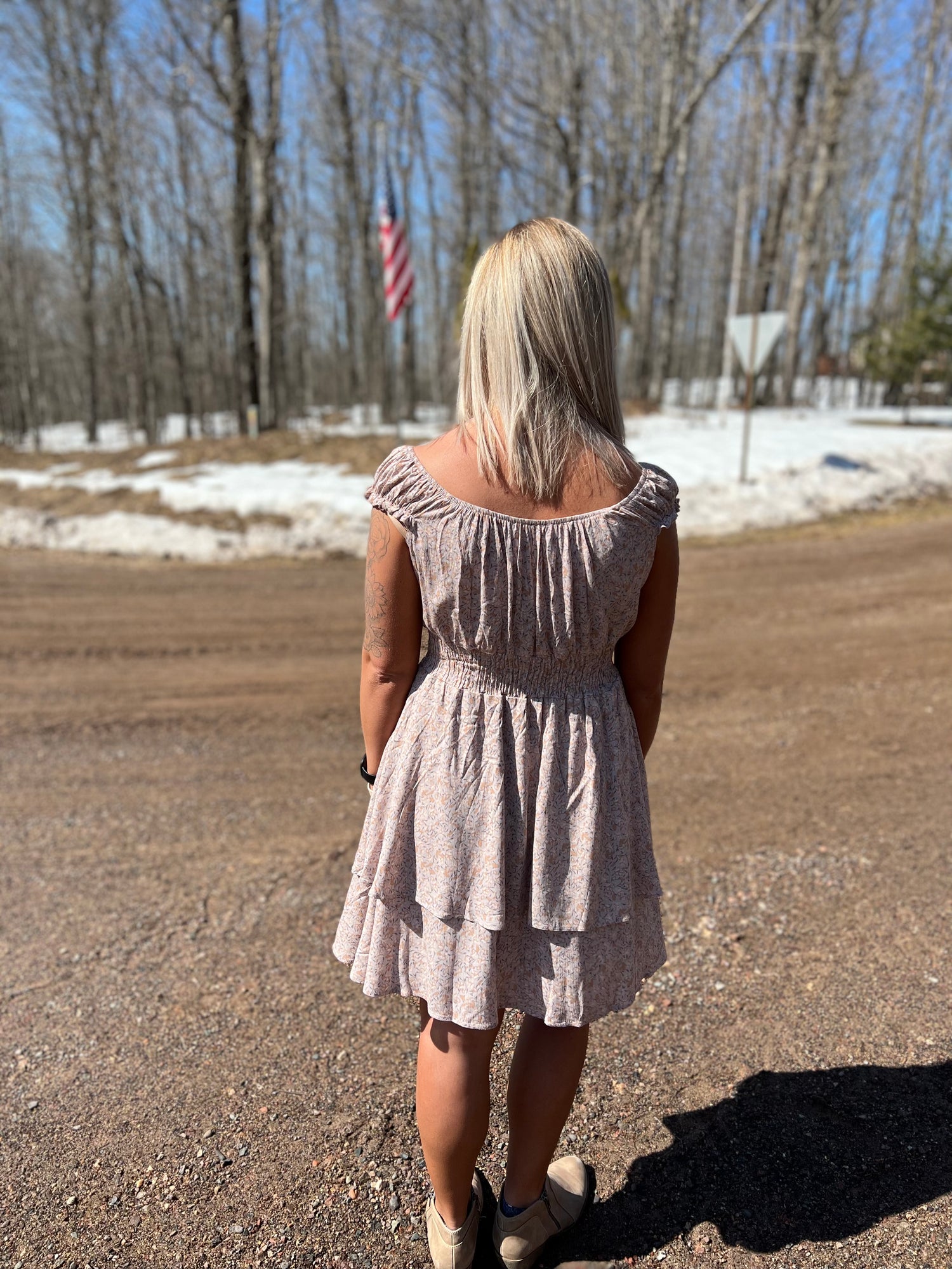 The back of a floral print pink mini dress