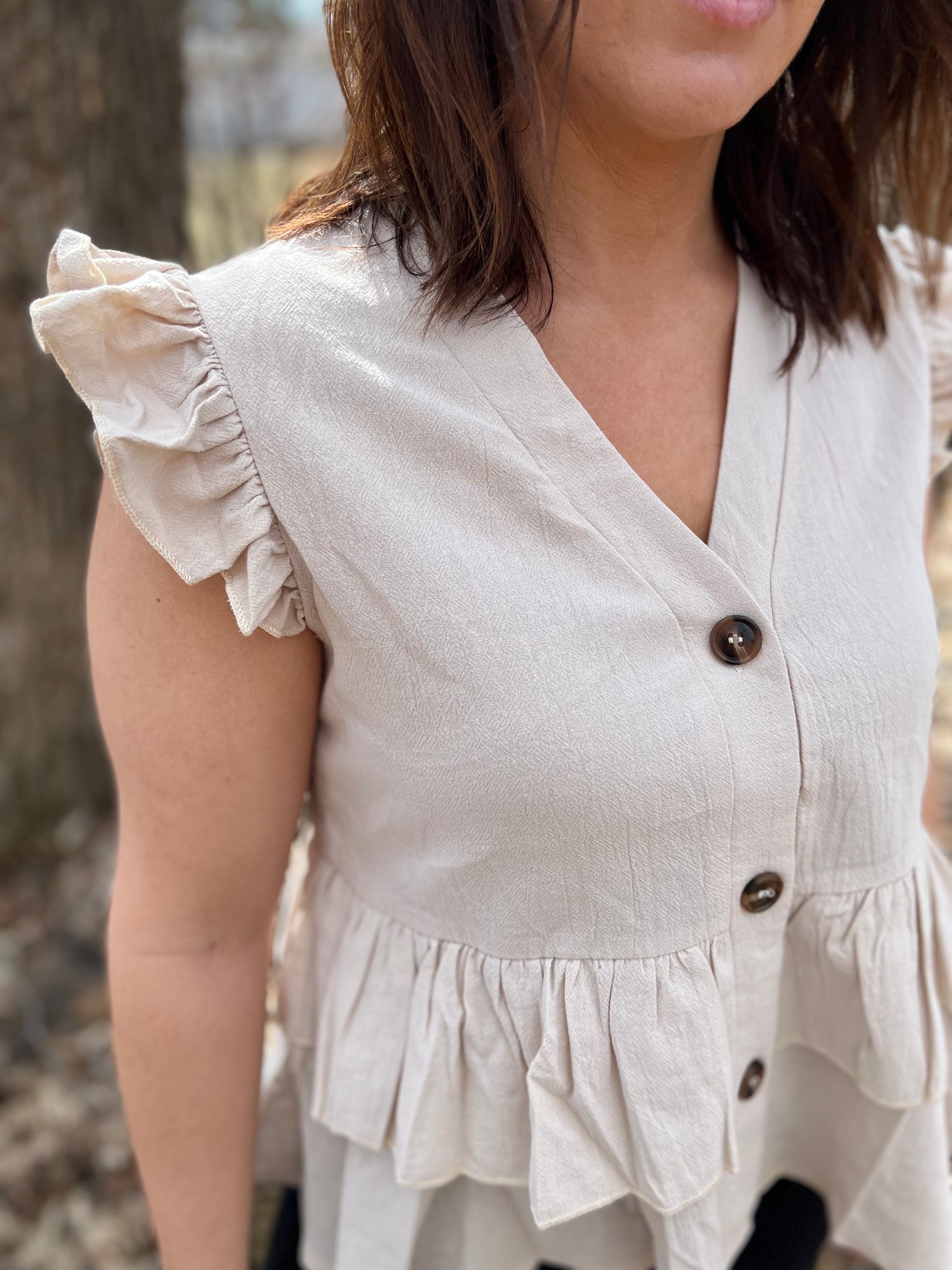 Beige button-up blouse with ruffle sleeves 